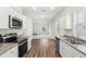 Beautiful kitchen with stainless steel appliances, granite countertops, and a view into the living room at 544 Pender Woods Dr, Summerville, SC 29486