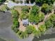 Overhead view of a home nestled in trees on a waterfront property, with a tranquil creek or river at 5569 Frisco Ln, Johns Island, SC 29455