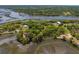 Aerial shot of houses among lush foliage, waterways, and docks at 5569 Frisco Ln, Johns Island, SC 29455