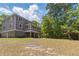 Expansive backyard featuring a well-maintained lawn, offering space for outdoor activities and entertainment at 5569 Frisco Ln, Johns Island, SC 29455
