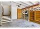 Finished basement with stairs, built-in wooden cabinets, and concrete floors, suitable for storage or recreation at 5569 Frisco Ln, Johns Island, SC 29455