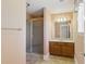 Bathroom with glass enclosed shower, single sink vanity and ceramic tile flooring at 5569 Frisco Ln, Johns Island, SC 29455