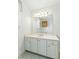 Bathroom vanity with white cabinets, quartz counters, and an framed mirror at 5569 Frisco Ln, Johns Island, SC 29455