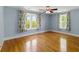 Bright bedroom featuring hardwood floors, ceiling fan and natural light at 5569 Frisco Ln, Johns Island, SC 29455