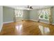 Bright bedroom featuring hardwood floors, ceiling fan and natural light at 5569 Frisco Ln, Johns Island, SC 29455