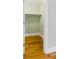 Bright walk-in closet with custom shelving and hardwood floors at 5569 Frisco Ln, Johns Island, SC 29455