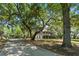 Spacious two-story home with a long driveway and mature trees, offering a serene and private setting at 5569 Frisco Ln, Johns Island, SC 29455