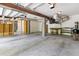 Large open garage showing the concrete floor, cinder block walls and additional storage space at 5569 Frisco Ln, Johns Island, SC 29455