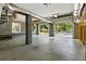 Spacious two car garage with concrete flooring, cinder block walls, and two garage doors opening to the home exterior at 5569 Frisco Ln, Johns Island, SC 29455