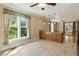 View of dining area and kitchen island, and cabinets with window views at 5569 Frisco Ln, Johns Island, SC 29455