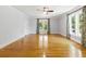 Spacious living room with gleaming hardwood floors, ample natural light, and neutral paint scheme at 5569 Frisco Ln, Johns Island, SC 29455