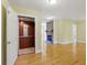 Bright living room featuring a stone fireplace with hardwood floors and a residential elevator for accessibility at 5569 Frisco Ln, Johns Island, SC 29455