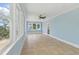 Sunroom featuring tile floor, lots of windows, and a ceiling fan at 5569 Frisco Ln, Johns Island, SC 29455