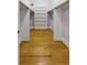 Expansive walk-in closet boasting hardwood floors, a built-in shelving unit, and hanging rods for optimal storage at 5569 Frisco Ln, Johns Island, SC 29455