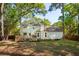 A spacious backyard features a well-maintained lawn and a deck for outdoor enjoyment and entertaining at 595 Crowned Kinglet Retreat, Charleston, SC 29412