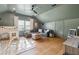 Comfortable bonus room with hardwood floors, a ceiling fan, and a cozy sitting area, ideal for play or relaxation at 595 Crowned Kinglet Retreat, Charleston, SC 29412