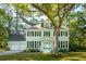Charming two-story home with well-maintained lawn, lush landscaping and a two-car garage at 595 Crowned Kinglet Retreat, Charleston, SC 29412