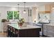 Bright, airy kitchen featuring a large center island, modern appliances, and views to the backyard at 595 Crowned Kinglet Retreat, Charleston, SC 29412