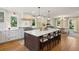 Kitchen island has bar seating and provides a view into the dining room at 595 Crowned Kinglet Retreat, Charleston, SC 29412