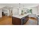 Spacious kitchen island with seating, ample storage, a wine fridge, and a view of backyard at 595 Crowned Kinglet Retreat, Charleston, SC 29412