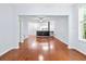 Living room features hardwood floors, open layout, and seamless transition to the dining area and kitchen at 60 Fenwick Hall Allee # 321, Johns Island, SC 29455