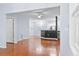 Open-concept living area with hardwood floors, modern lighting, and a clear view into the contemporary kitchen at 60 Fenwick Hall Allee # 321, Johns Island, SC 29455