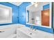 Bathroom with blue walls, tile floors, and modern fixtures at 7 Andrea Ct, Hanahan, SC 29410