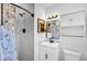 Bright bathroom featuring marble tiled shower and bronze fixtures at 7 Andrea Ct, Hanahan, SC 29410
