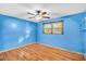 Bedroom features include wood floors, bright blue walls, and a ceiling fan at 7 Andrea Ct, Hanahan, SC 29410
