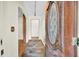 Inviting foyer with slate tile flooring and detailed wood trim around the front door at 7 Andrea Ct, Hanahan, SC 29410