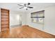 Bright living room featuring hardwood floors, built-in shelves, and a window at 7 Andrea Ct, Hanahan, SC 29410