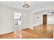 Bright living room showcasing hardwood floors and open layout with kitchen view at 7 Andrea Ct, Hanahan, SC 29410
