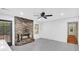 Bright living room featuring brick fireplace, ceiling fan, and neutral flooring at 7 Andrea Ct, Hanahan, SC 29410
