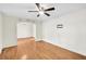 Bright living room with hardwood floors, a ceiling fan, and an arched doorway at 7 Andrea Ct, Hanahan, SC 29410