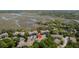 Aerial view showcases condo complex nestled amidst trees, highlighting the location with a pinpoint marker at 700 Daniel Ellis Dr # 10307, Charleston, SC 29412