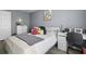 Cozy bedroom featuring a bed, desk, and serene gray walls, creating a peaceful space at 700 Daniel Ellis Dr # 10307, Charleston, SC 29412