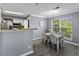 Cozy dining area with table, chairs, and natural light from the large window at 700 Daniel Ellis Dr # 10307, Charleston, SC 29412
