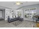 Comfortable living room with stylish gray sofa, built-in bookshelves, and natural light from the windows at 700 Daniel Ellis Dr # 10307, Charleston, SC 29412