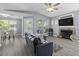 Bright living room with fireplace, modern furniture, and open view to the dining area at 700 Daniel Ellis Dr # 10307, Charleston, SC 29412