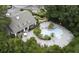 Aerial view of a community pool and lounge area surrounded by landscaped gardens and mature trees at 700 Daniel Ellis Dr # 10307, Charleston, SC 29412