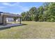 Spacious backyard featuring a covered patio, perfect for outdoor gatherings and enjoying the serene surroundings at 707 Butter Rd, Bonneau, SC 29431