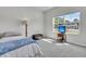 Comfortable bedroom with soft carpet, natural light, and a TV for relaxation at 707 Butter Rd, Bonneau, SC 29431