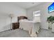 Cozy bedroom featuring plush carpeting, ample natural light, and a classic wood-frame bed at 707 Butter Rd, Bonneau, SC 29431
