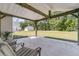 Inviting covered patio with string lights and comfortable seating, creating a cozy outdoor space at 707 Butter Rd, Bonneau, SC 29431