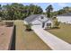 Charming home featuring a two-car garage and a well-maintained front yard with beautiful landscaping at 707 Butter Rd, Bonneau, SC 29431