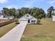 An aerial view showing the home's front lawn, driveway, and surrounding greenery at 707 Butter Rd, Bonneau, SC 29431