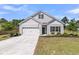 Charming single-Gathering home with manicured lawn and attached two-car garage at 707 Butter Rd, Bonneau, SC 29431