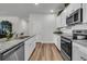 Kitchen featuring granite countertops, stainless steel appliances and wood floors at 707 Butter Rd, Bonneau, SC 29431