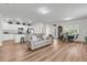 Open-concept living room with eat-in kitchen and dining area with outdoor access at 707 Butter Rd, Bonneau, SC 29431