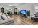 Inviting living and dining area with wood-look floors, creating a seamless flow for comfortable living and entertaining at 707 Butter Rd, Bonneau, SC 29431